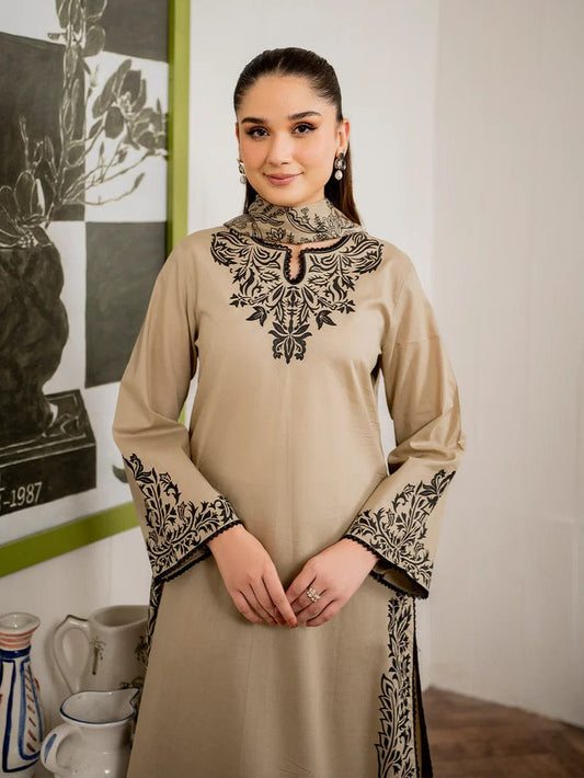 Elegant sand-colored embroidered shirt for women with intricate black threadwork.