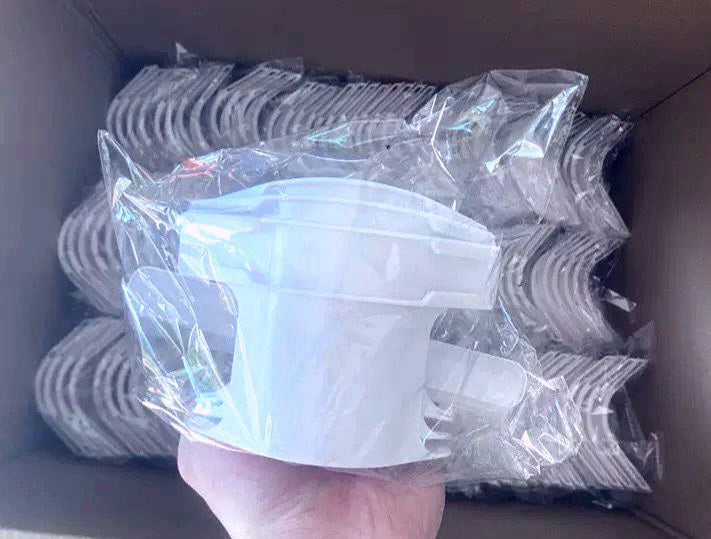 Detail of non-slip plastic clenching system to protect bedsheet fabric.