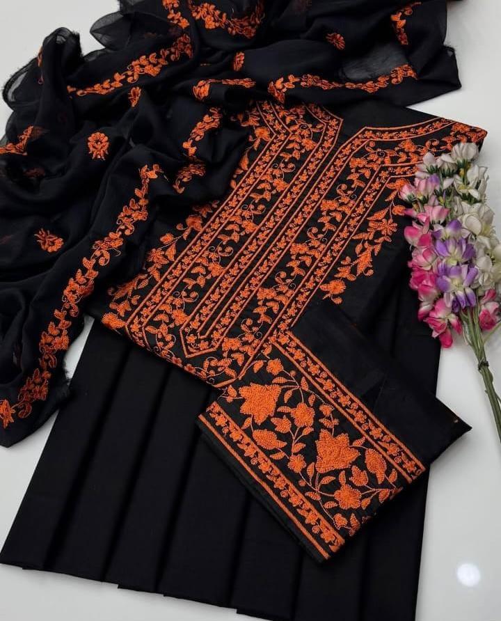 Unstitched 3-piece black lawn cotton suit with heavy orange floral embroidery and matching chiffon dupatta.