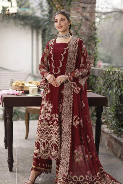 Pakistani women's luxury maroon formal dress with cutwork daman.