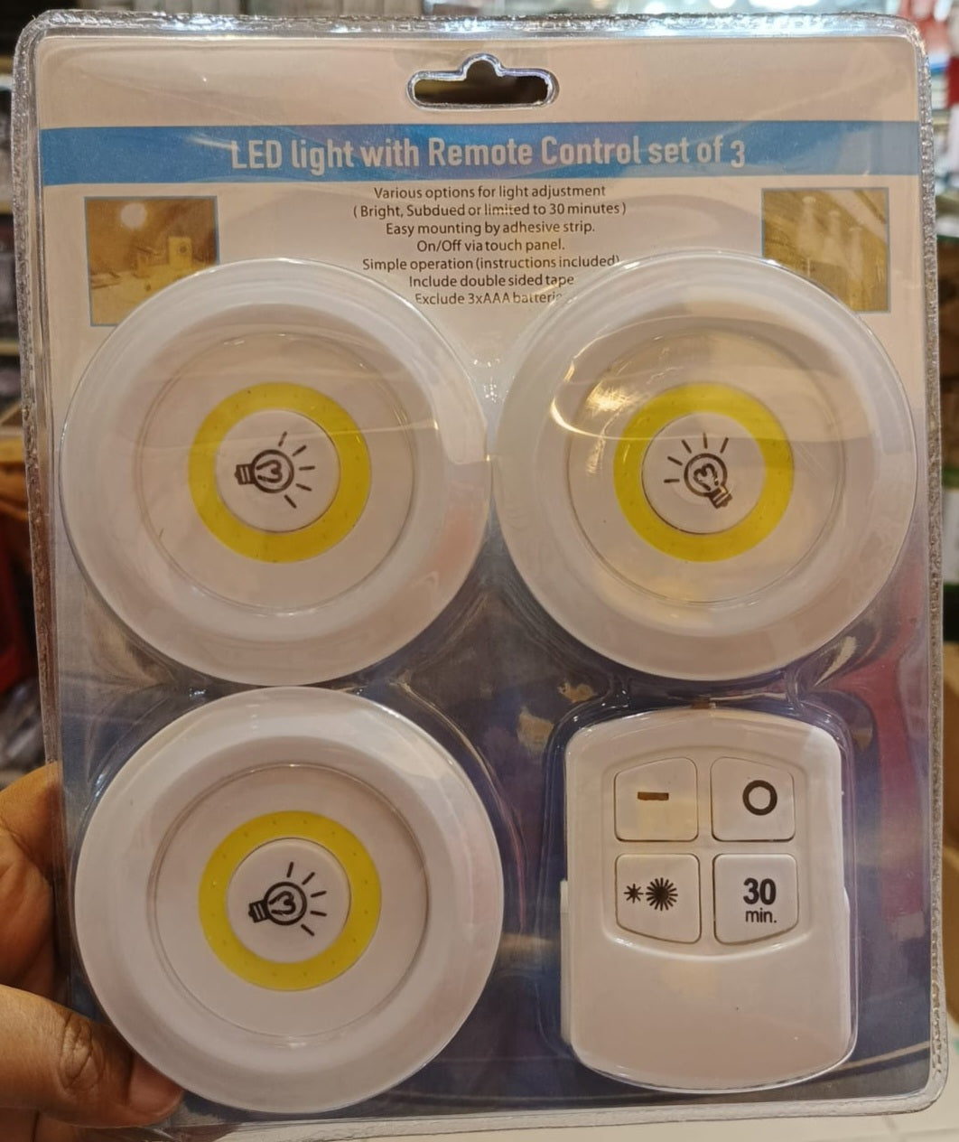 Battery operated stick on led puck lights for closet and shelves