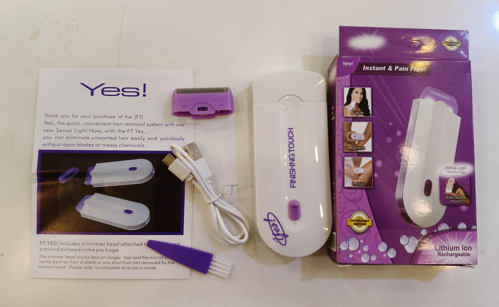 Handheld electric trimmer removing hair painlessly from the arm.