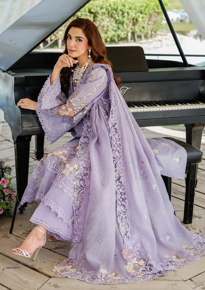 Elegant lavender festive suit featuring heavy floral embroidery and intricate laser-cut lace detailing."