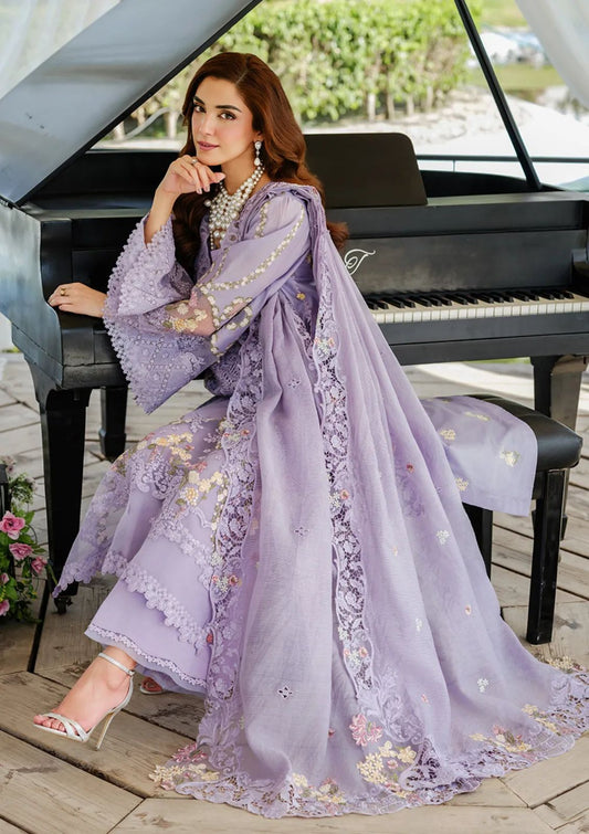 Elegant lavender festive suit featuring heavy floral embroidery and intricate laser-cut lace detailing."