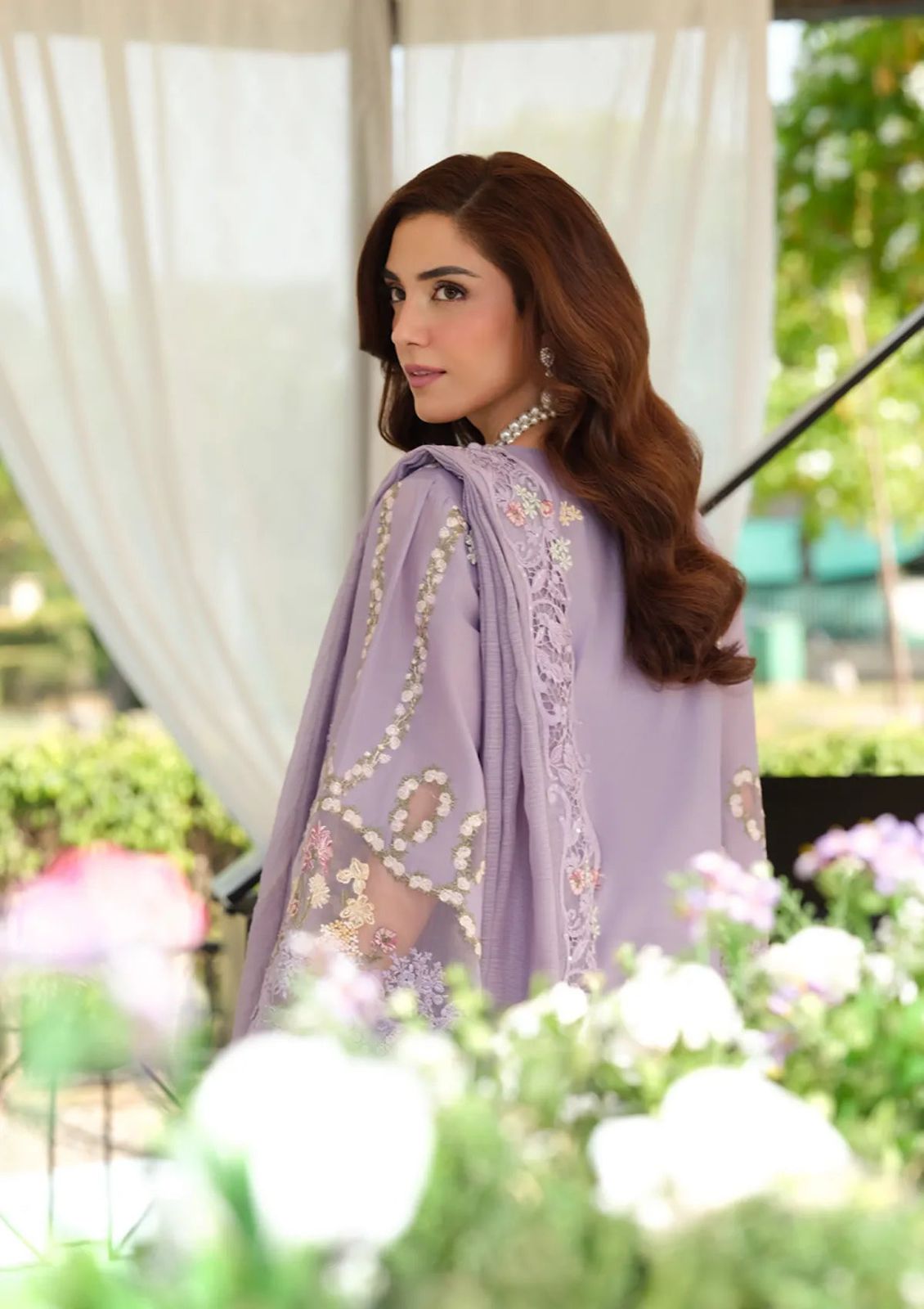 Modern Pakistani designer suit in lavender with a luxurious embroidered lace neckline."