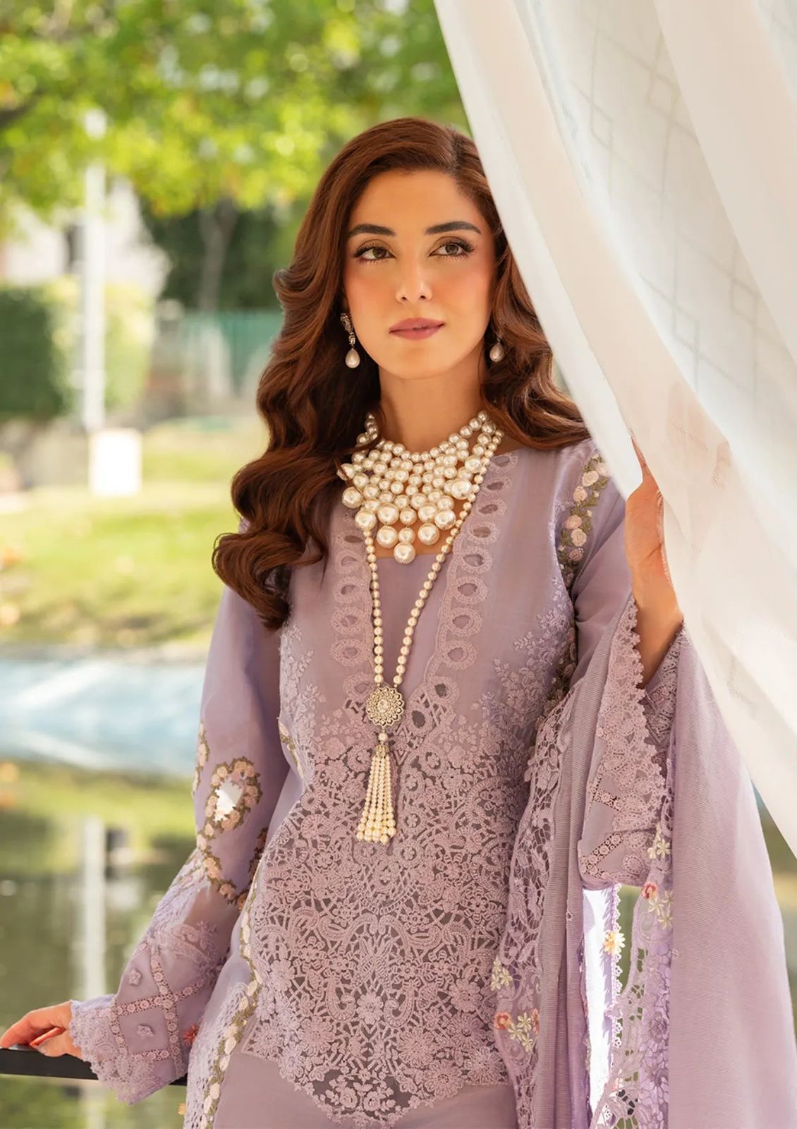 "Premium quality soft lavender fabric with detailed thread work and high-end embroidery."