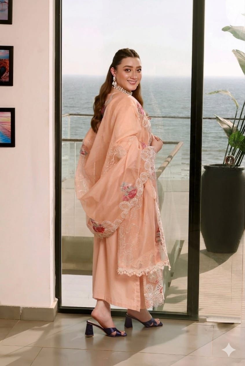 Beautifully embroidered peach dupatta with white lace borders.