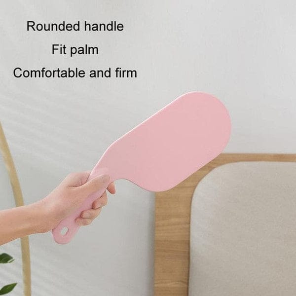Ergonomic bedsheet helper paddle for easy bed making in a modern bedroom.
