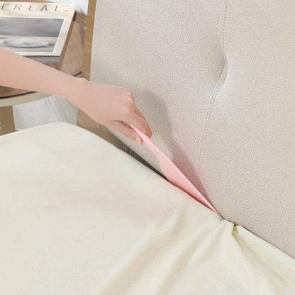 Ergonomic bedsheet helper paddle for easy bed making in a modern bedroom.