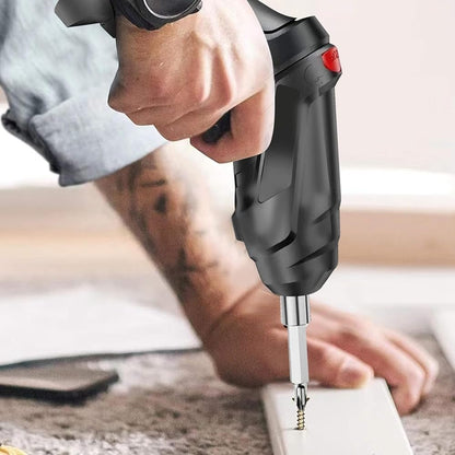 Person using a cordless drill on a wooden surface