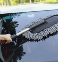 Long handle car duster tool for scratch-free automotive detailing.