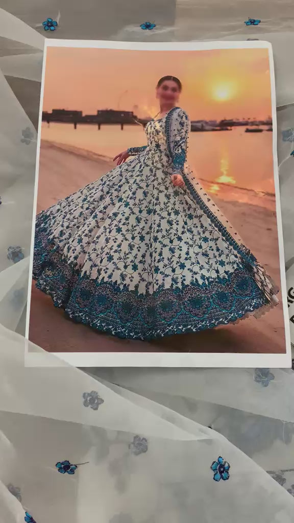 Traditional Pakistani long maxi dress with heavy blue borders for weddings.