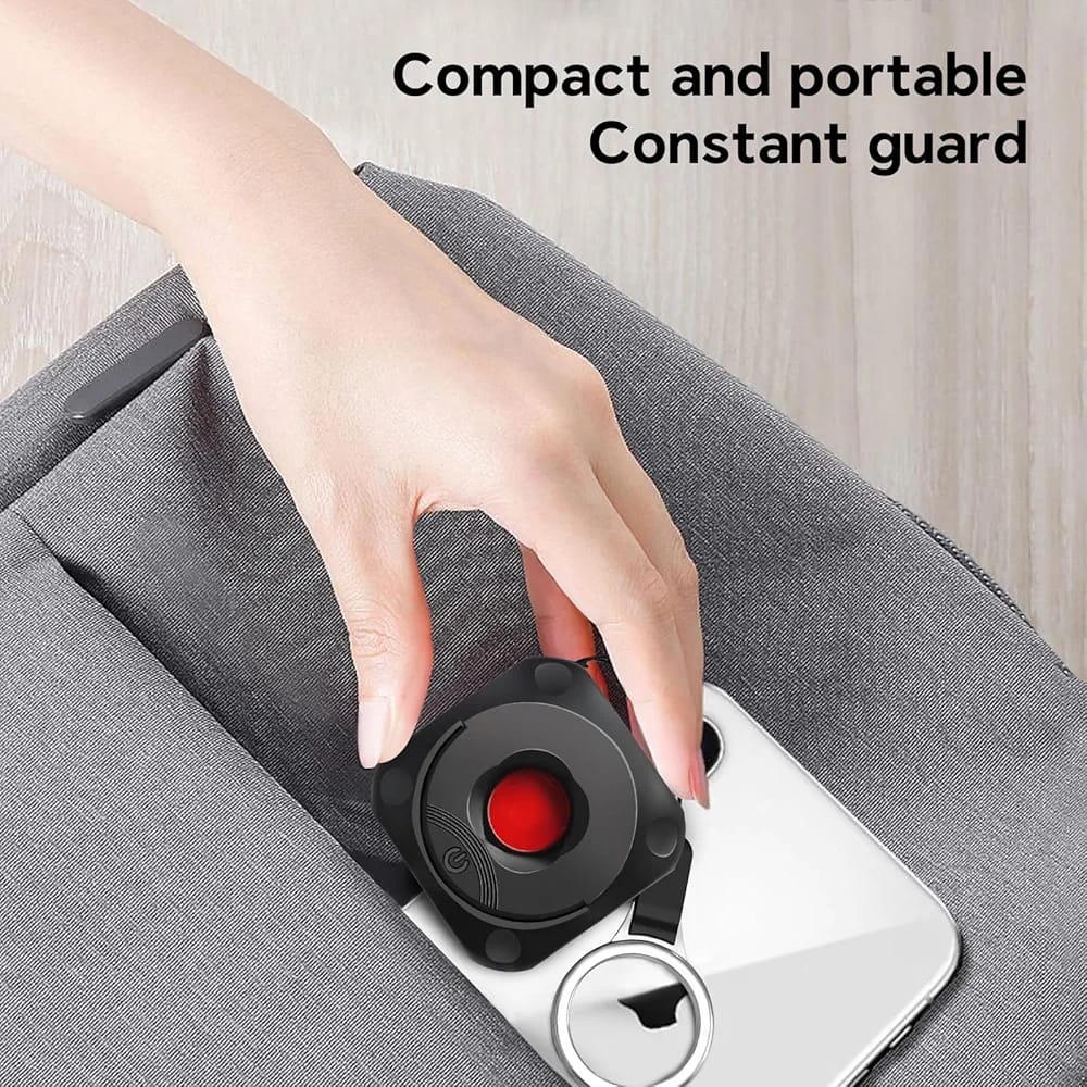 Portable infrared hidden camera detector showing red light scanning for pinhole lenses in hotel rooms and bathrooms