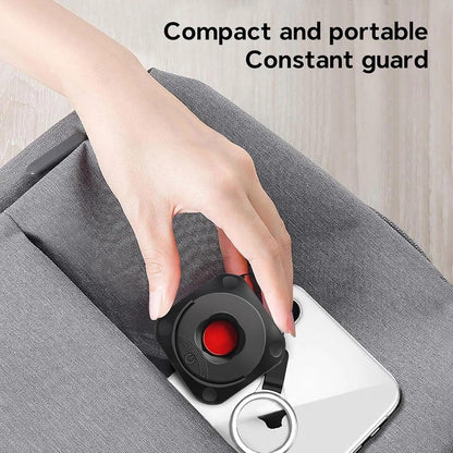 Portable infrared hidden camera detector showing red light scanning for pinhole lenses in hotel rooms and bathrooms