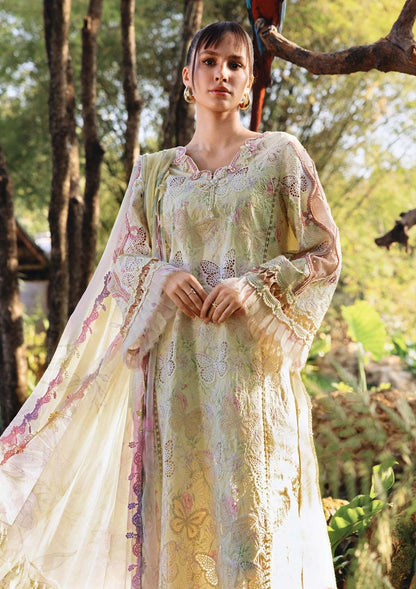 Detailed view of butterfly cutwork and organza frills on designer sleeves.