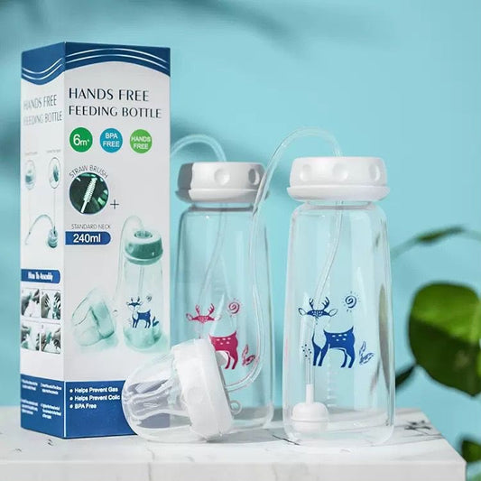 Hands-free feeding bottle with packaging on a light blue background