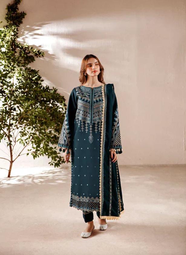 Close-up of intricate traditional embroidery on a premium unstitched Pakistani suit.
