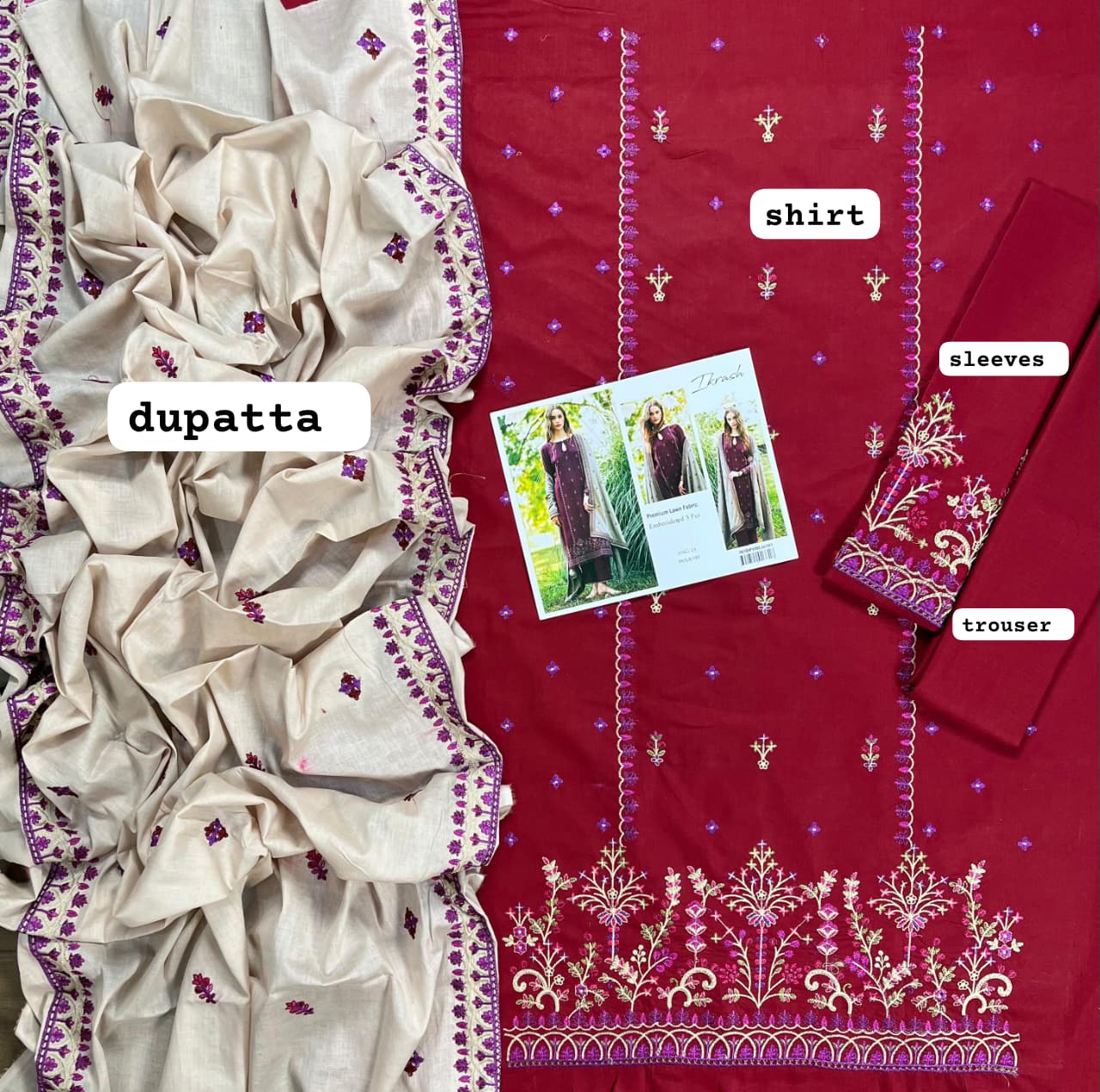 Elegant winter festive wear for women featuring intricate needlework on maroon fabric.