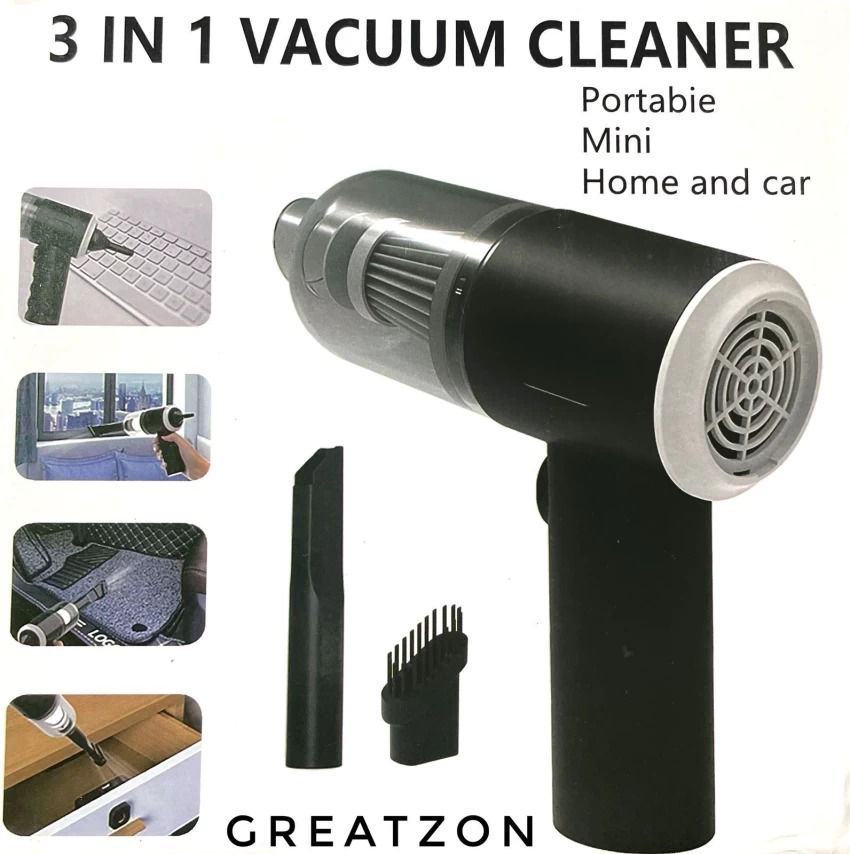 Mini wireless vacuum cleaner cleaning a computer keyboard.