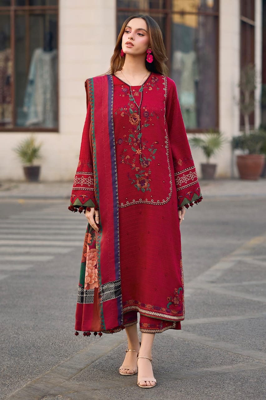 Model wearing a 3-piece maroon embroidered Pakistani suit with a floral printed dupatta standing on a street background.