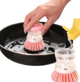 Refilling-dish-soap-into-the-transparent-body-of-a-cleaning-brush